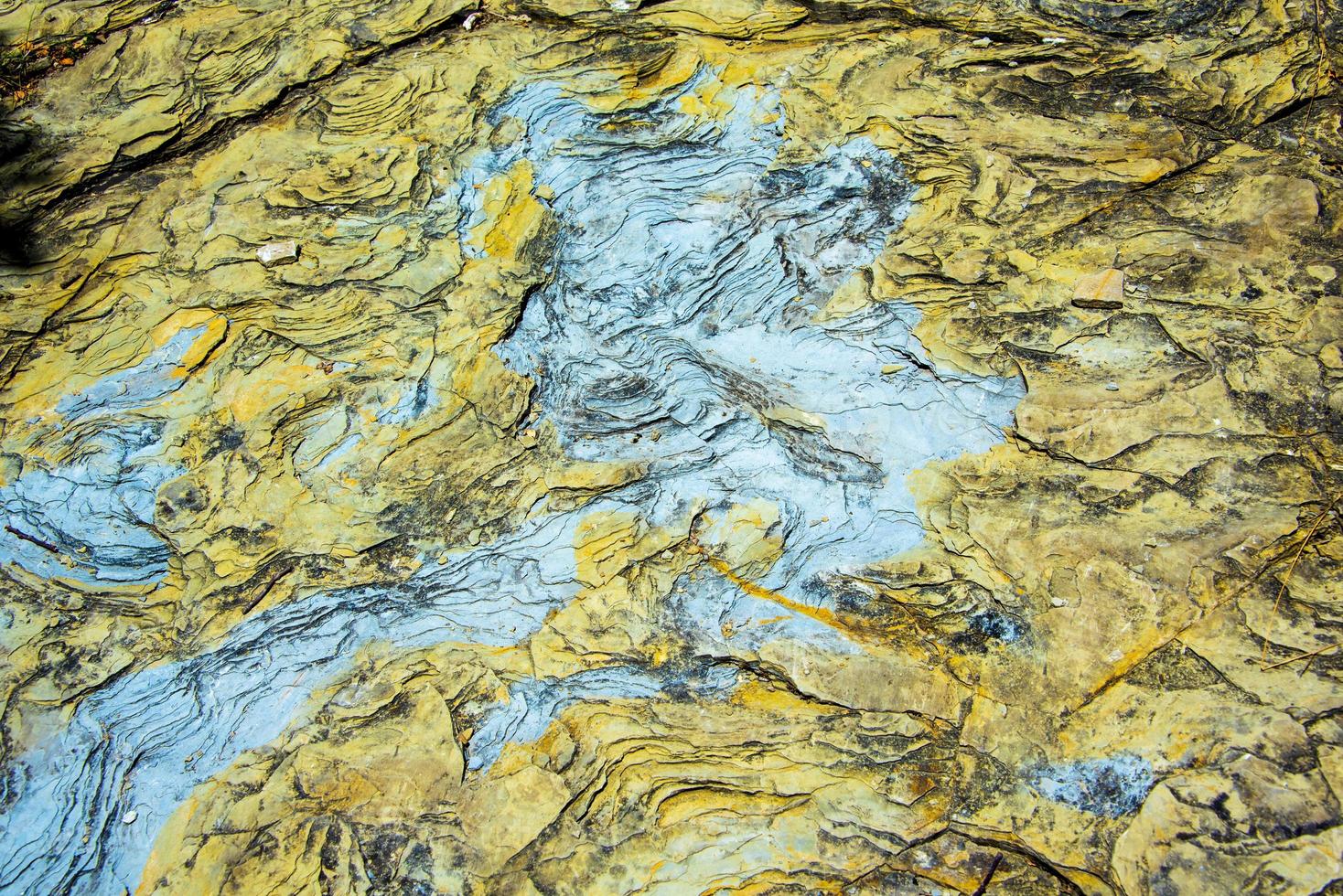 close-up de uma textura de mármore branco preto e amarelo foto
