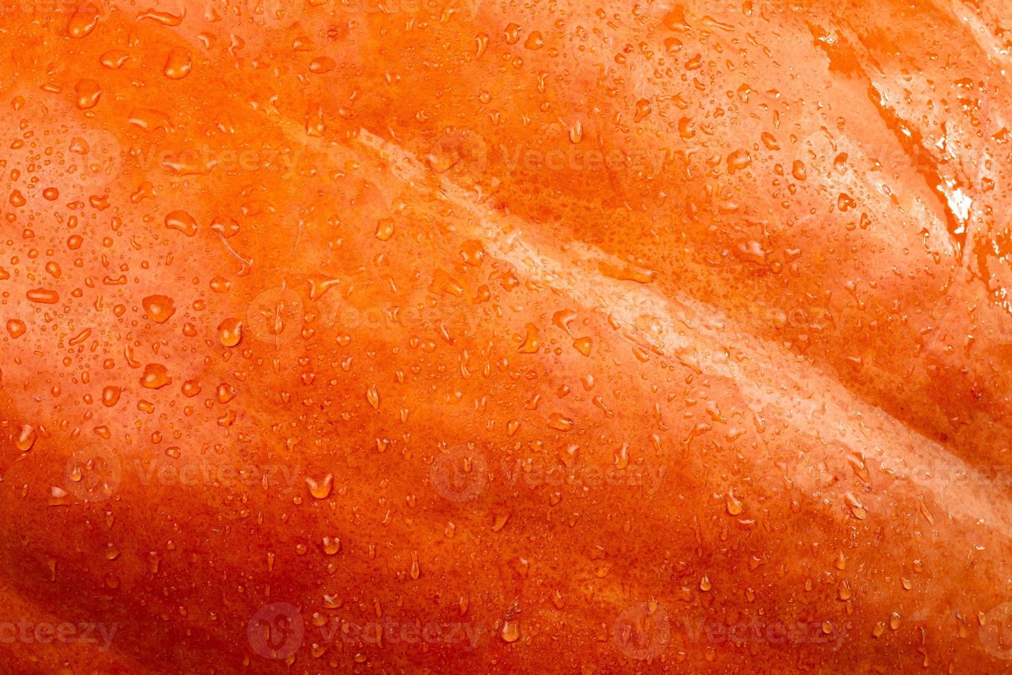 close-up abstrato com textura de fundo de uma abóbora laranja foto