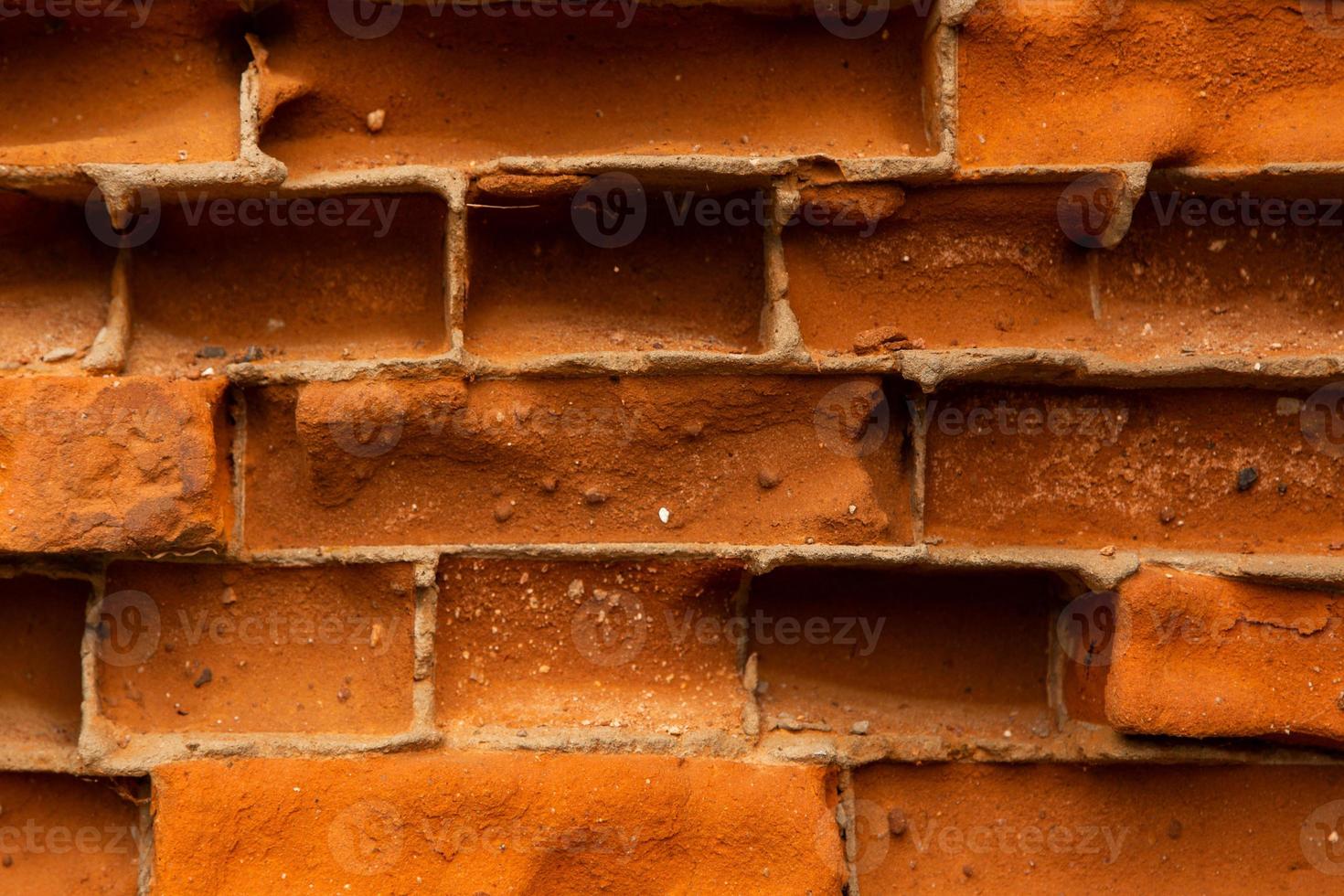 close-up de fundo de textura de parede de tijolo vermelho velho foto