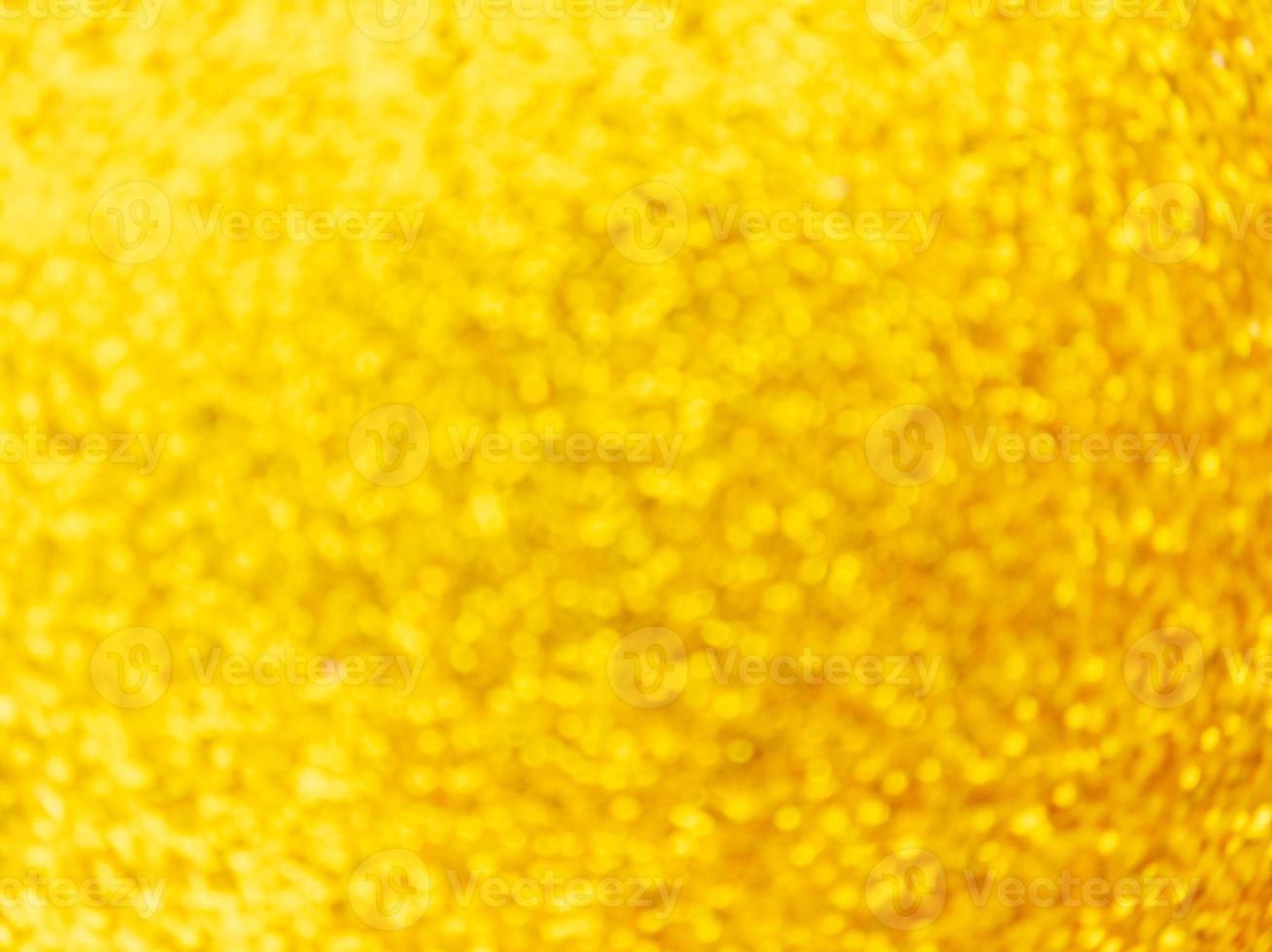 Luzes desfocadas douradas fundo festivo abstrato rodando bokeh foto