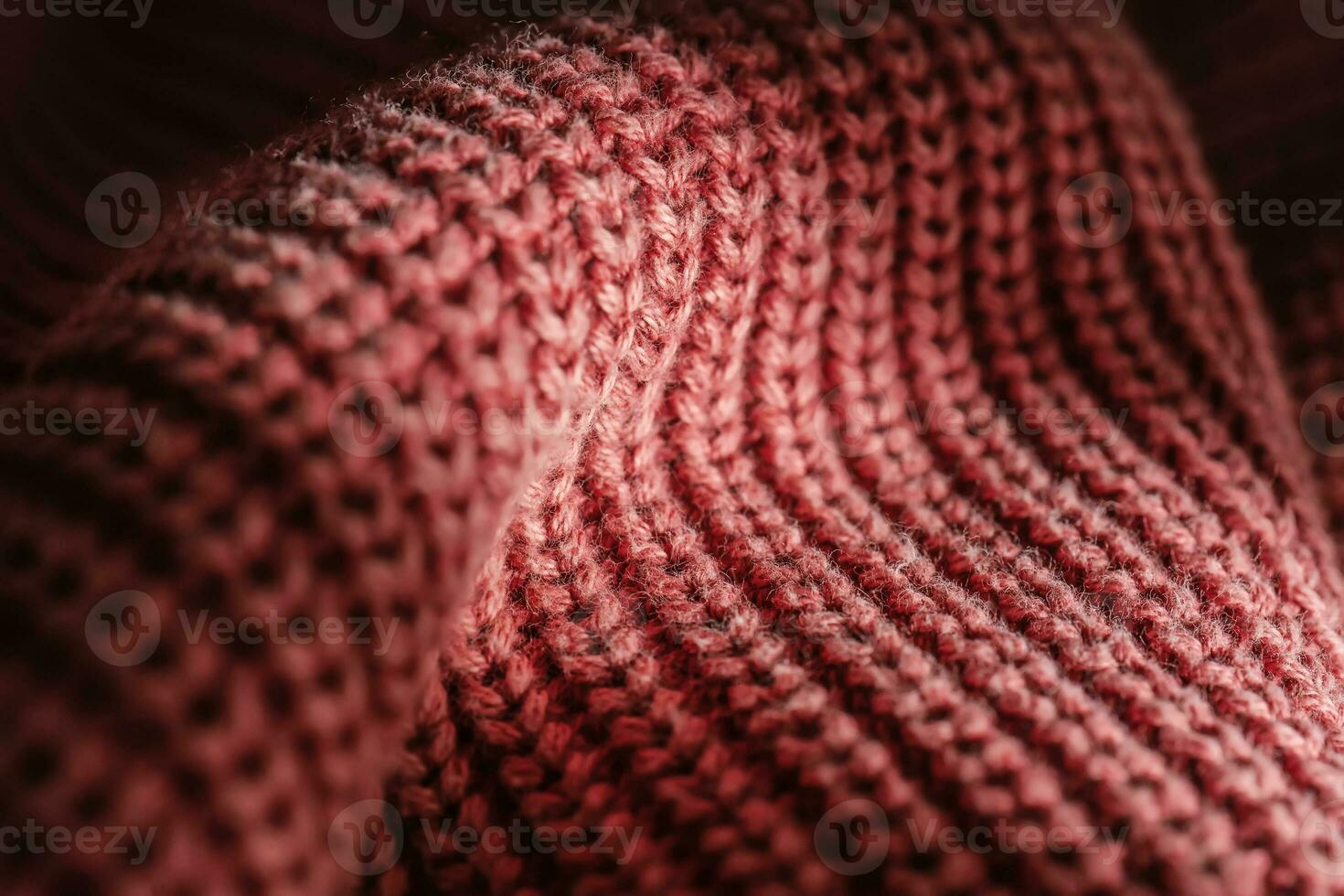 tricotado textura do uma Rosa suéter ou cachecol fechar-se. foto