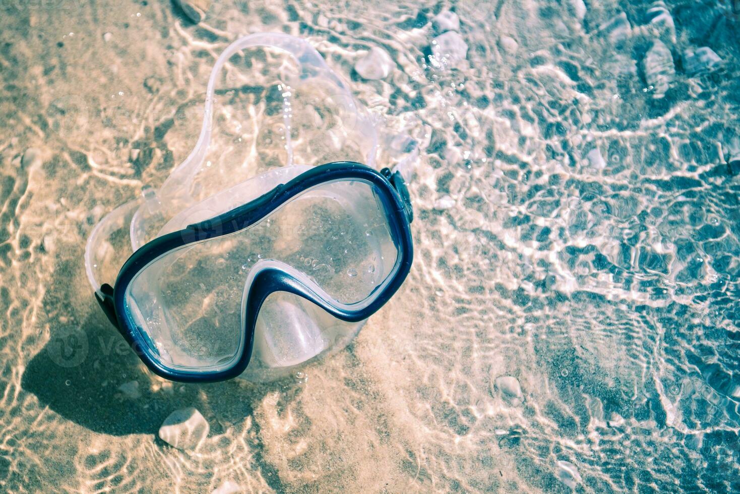 água óculos em a de praia foto