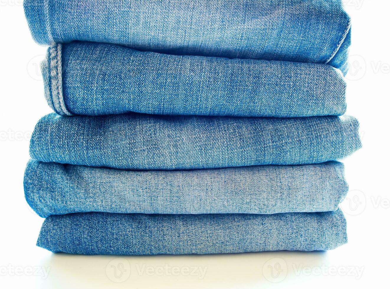 pilha de jeans azul, textura de tecido foto