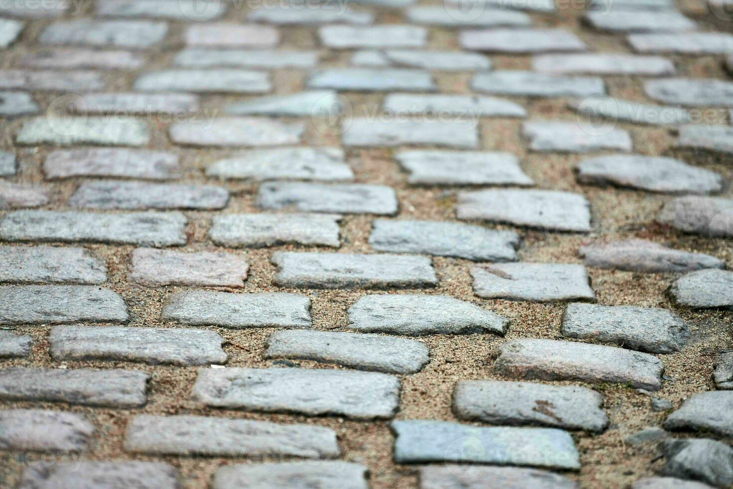 pedras de pavimentação na rua da cidade foto