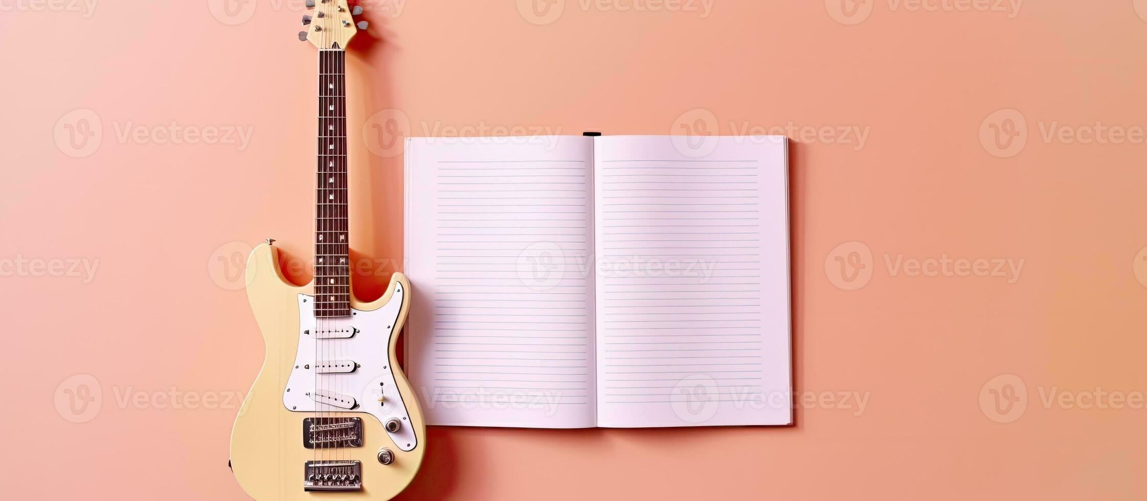 foto do uma guitarra e uma caderno em uma vibrante Rosa fundo com bastante do cópia de espaço com cópia de espaço