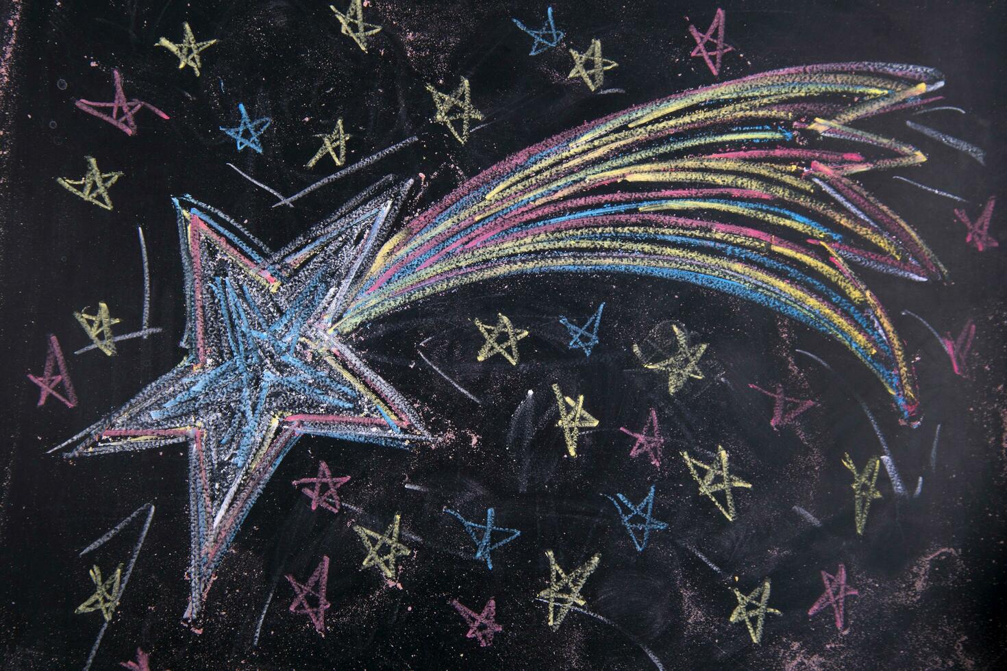 uma giz desenhando do uma Estrela em uma quadro-negro foto