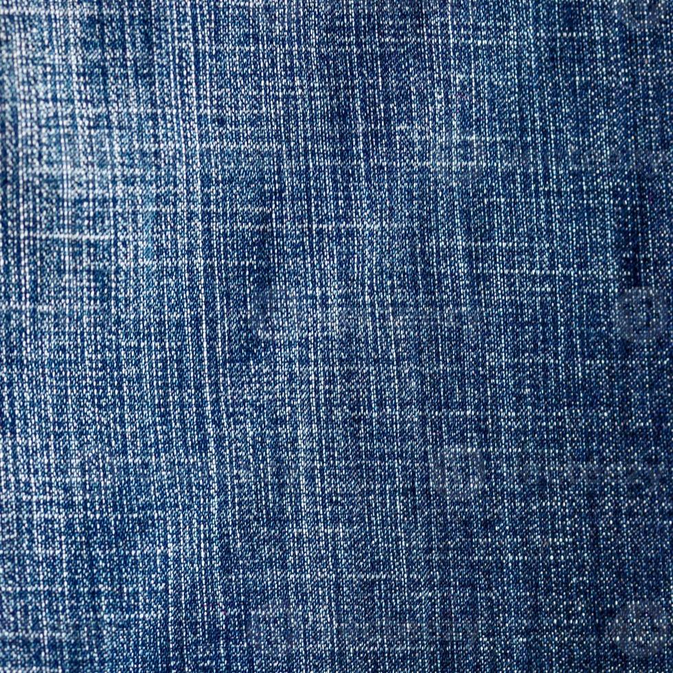 retângulo de jeans azul surrado, plano de fundo de material texturizado de jeans foto