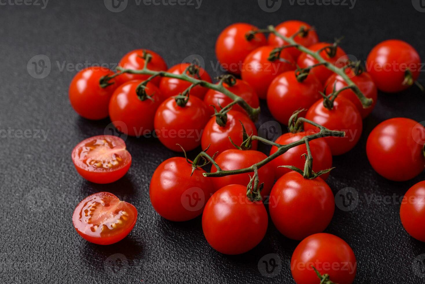 delicioso fresco cereja tomates em a galhos Como a ingrediente para cozinhando uma vegetariano prato foto