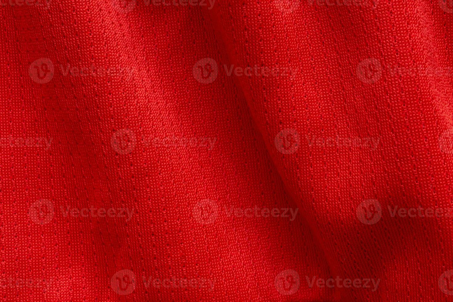 roupas esportivas vermelhas tecido camisa de futebol jersey fundo de textura foto