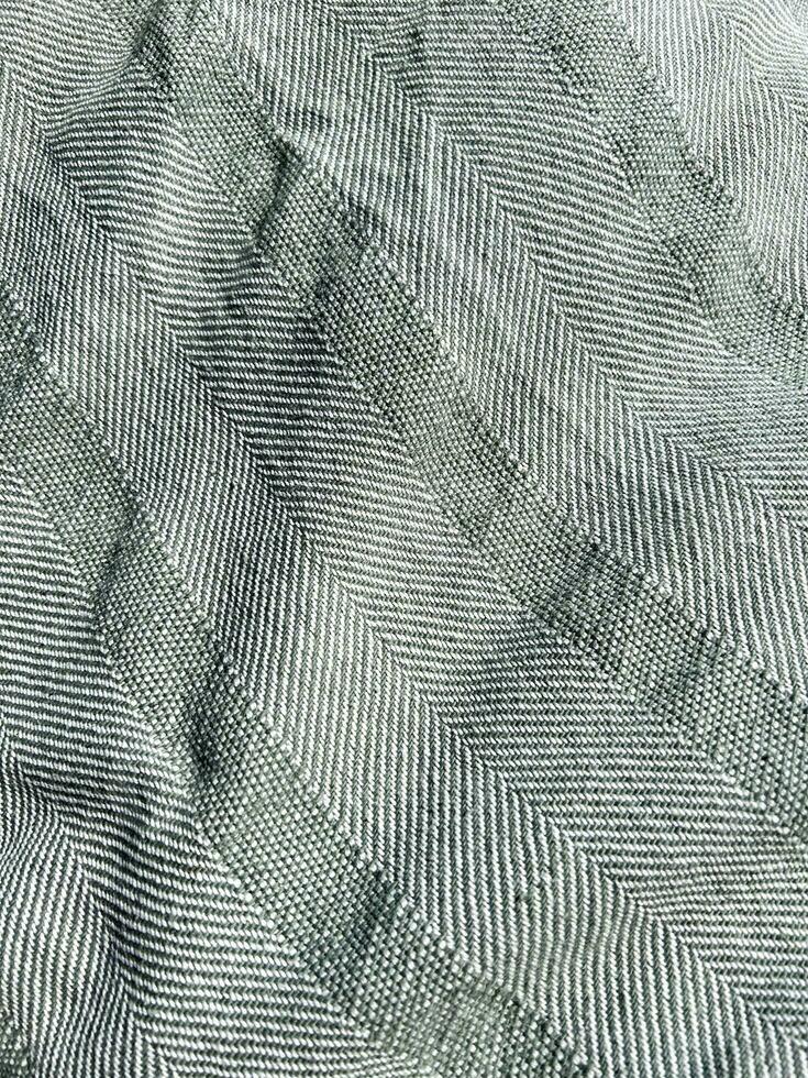 tecido abstrato fundo para seu Projeto. cópia de espaço. cinzento textura. espinha de peixe padronizar. monocromático texturizado fundo. dobras em tecido. foto