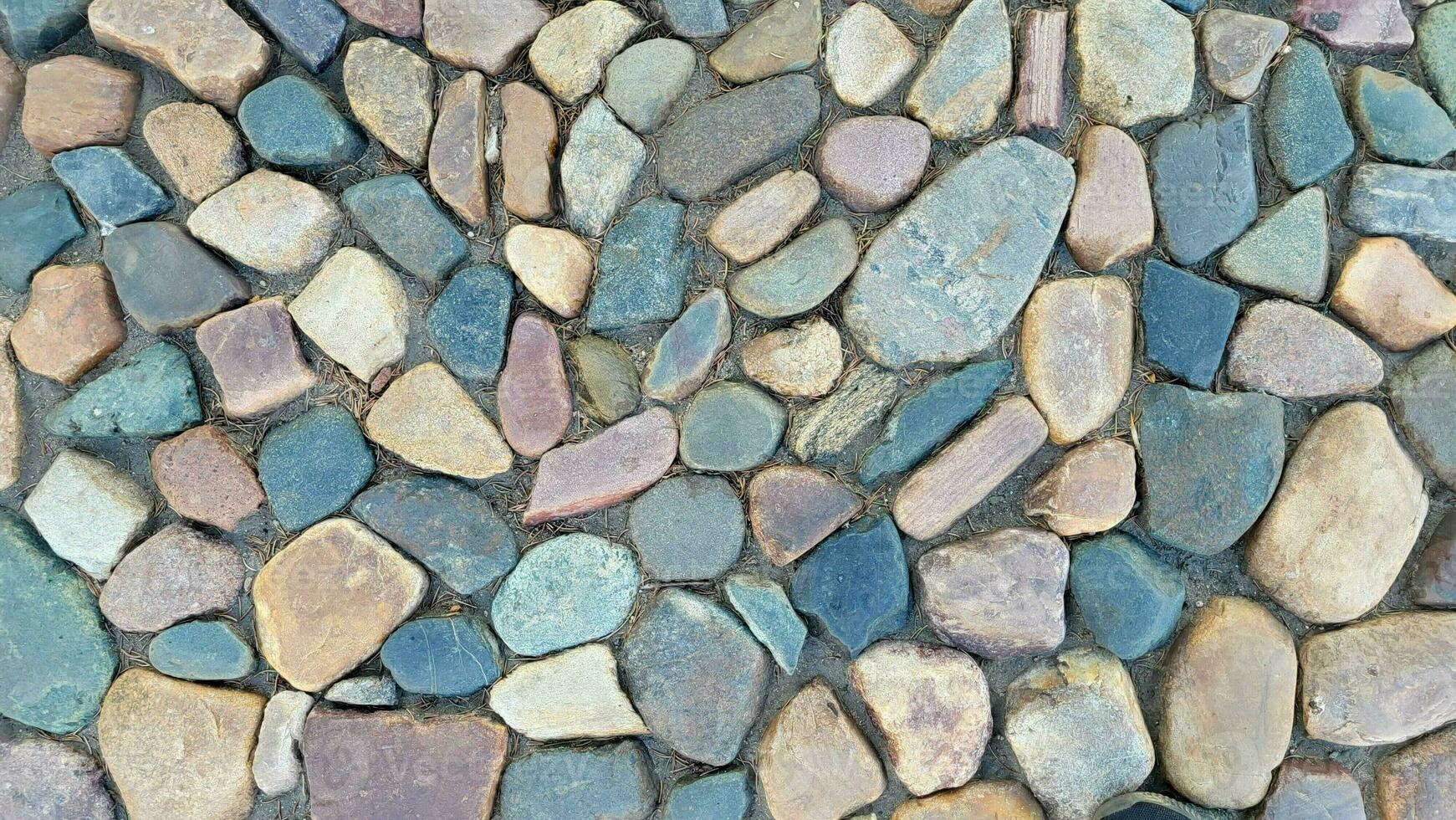 pedra textura para a fundo. multicolorido pedra pavimento. foto