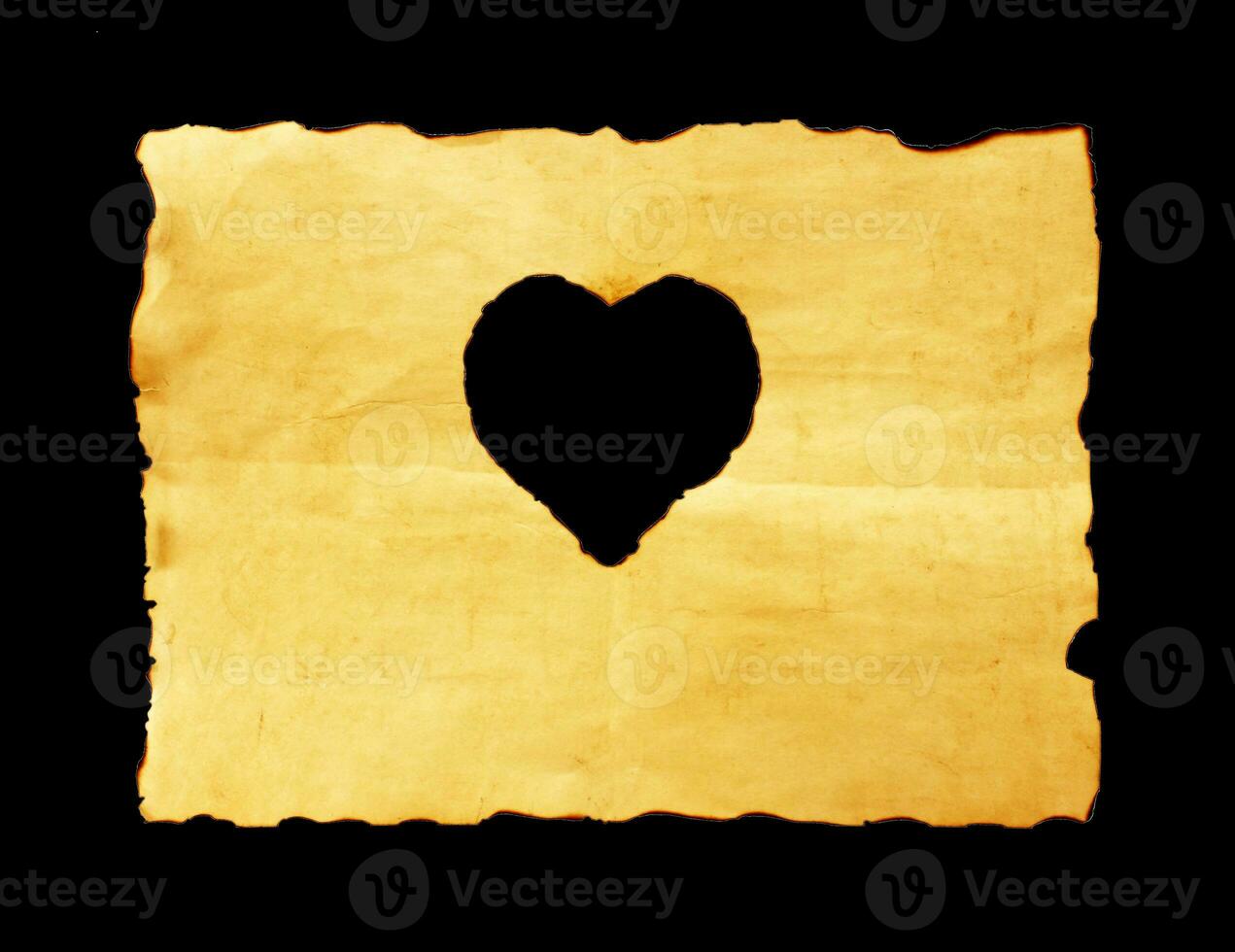velho papel Folha com coração símbolo em Preto fundo foto