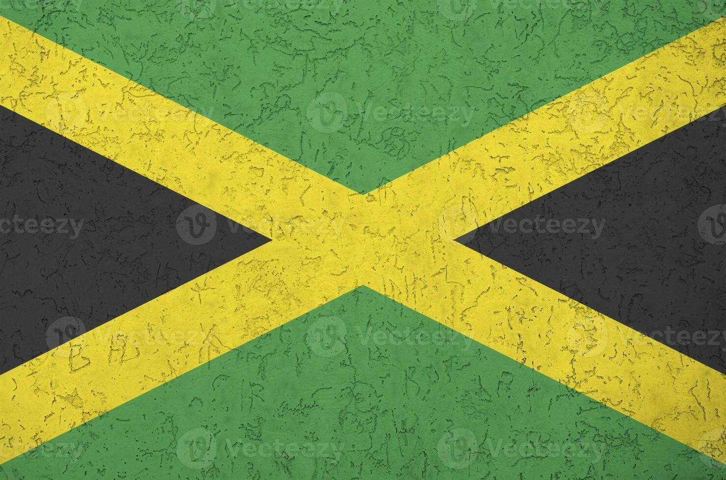 Jamaica bandeira retratado dentro brilhante pintura cores em velho alívio reboco muro. texturizado bandeira em rude fundo foto