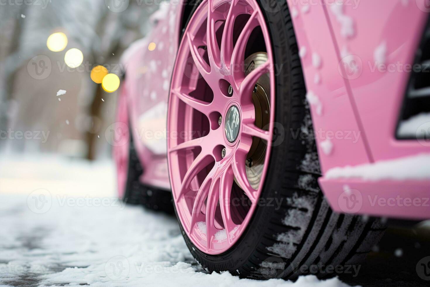 lado Visão do rodas com inverno pneus em uma Rosa carro em uma Nevado estrada foto