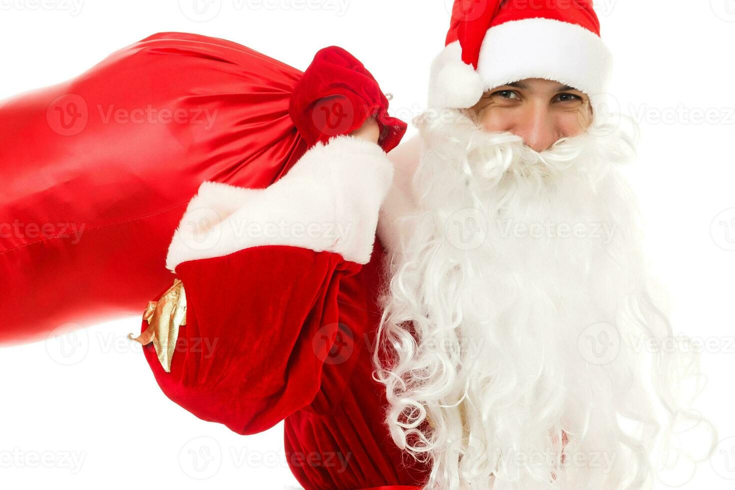 santa claus em pé acima em branco fundo com dele saco cheio do presentes foto