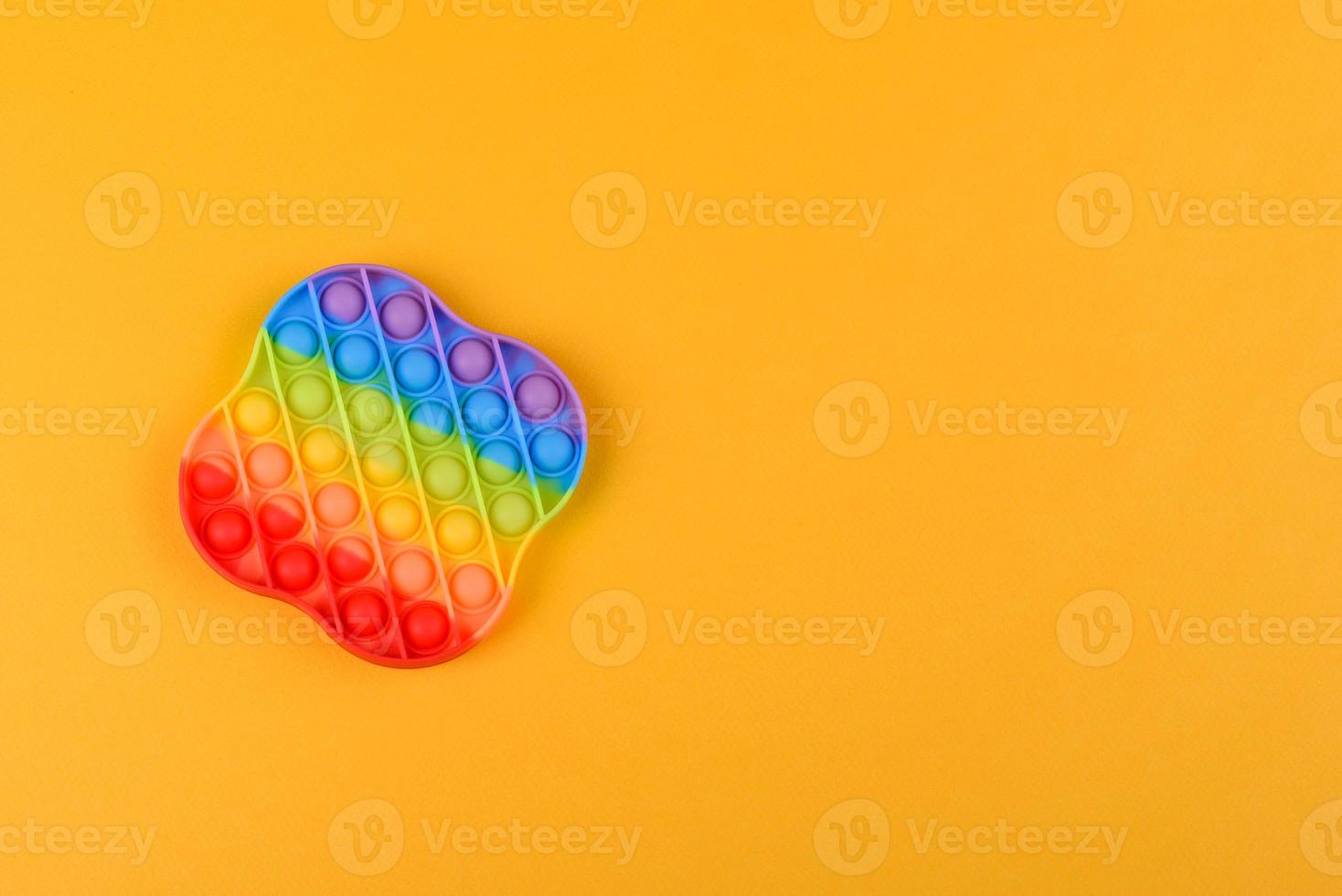 Brinquedo infantil colorido brilhante feito de silicone projetado para aliviar o estresse foto