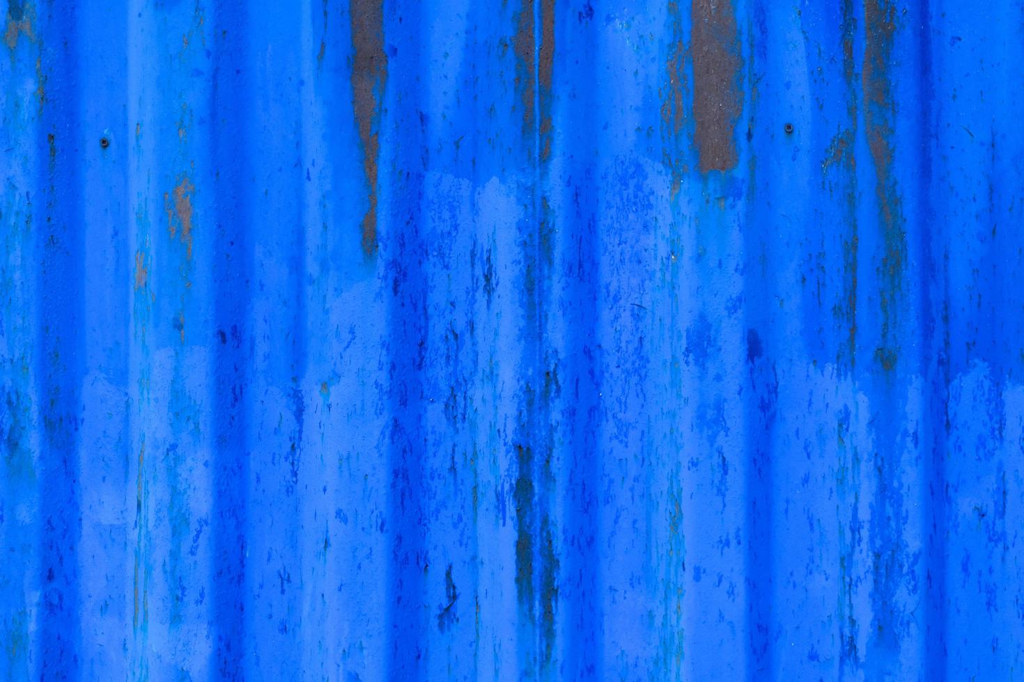 textura de parede de metal descascando azul foto
