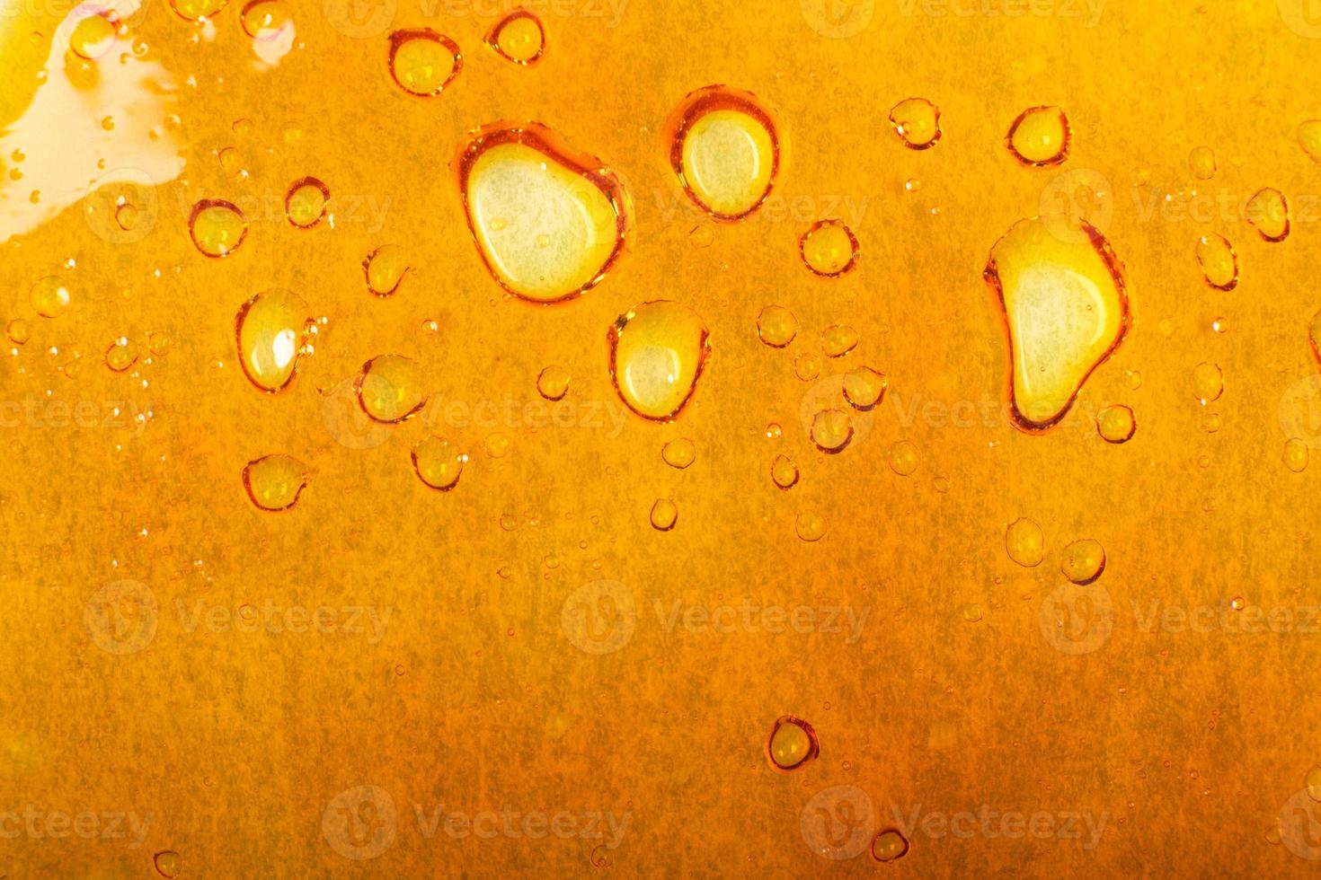 textura dourada de cera de cannabis, fundo de maconha foto