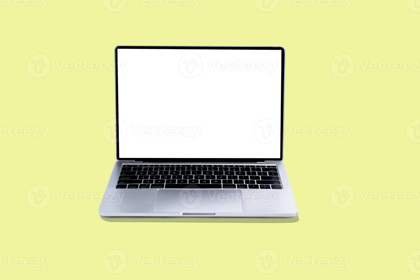 laptop e tela branca em fundo amarelo foto