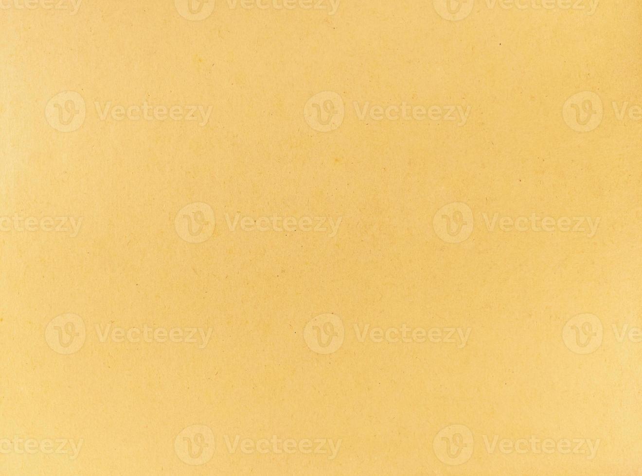 um fundo de textura grunge de papel amarelo antigo foto