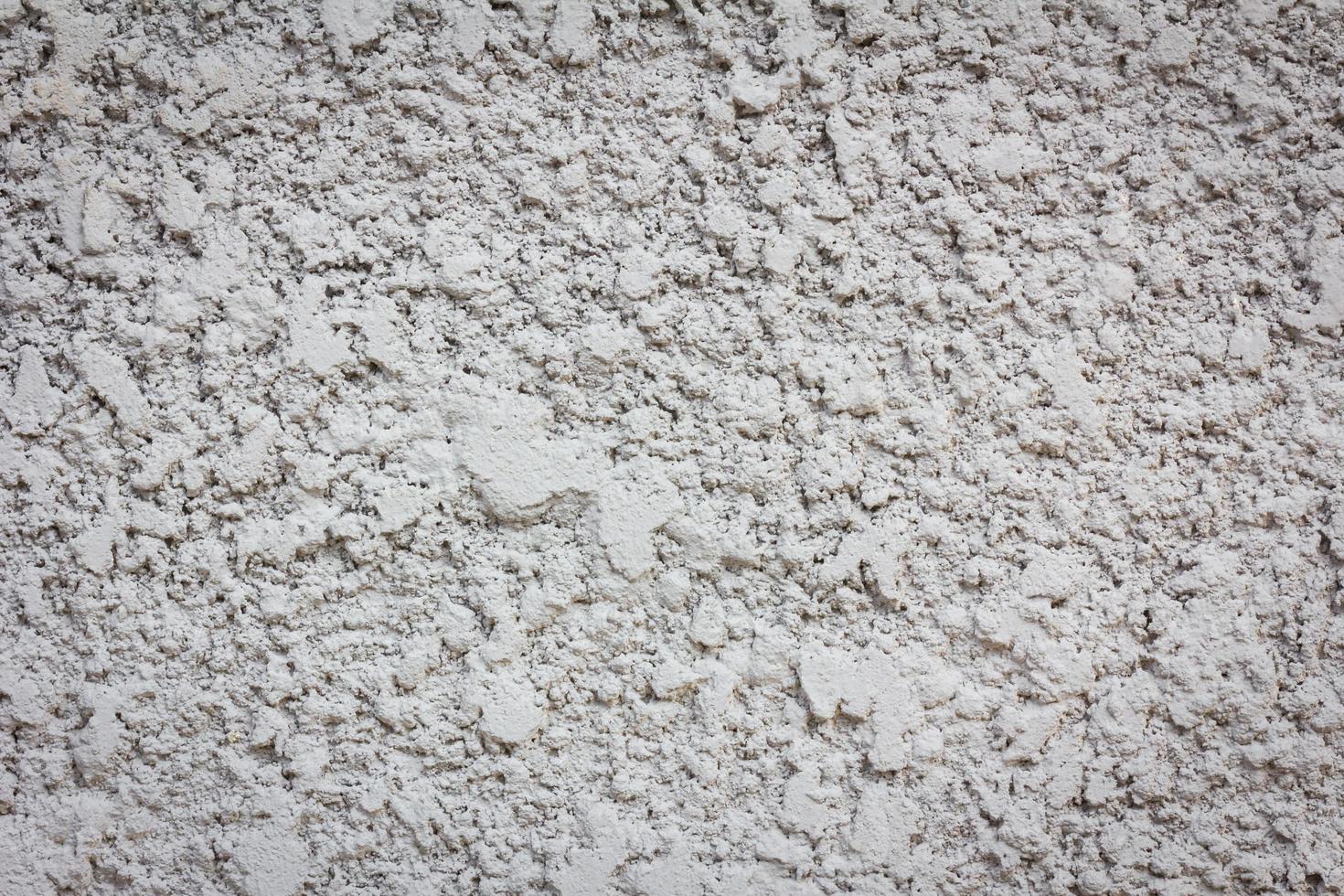 fundo de textura de parede de concreto de explosão de areia irregular foto