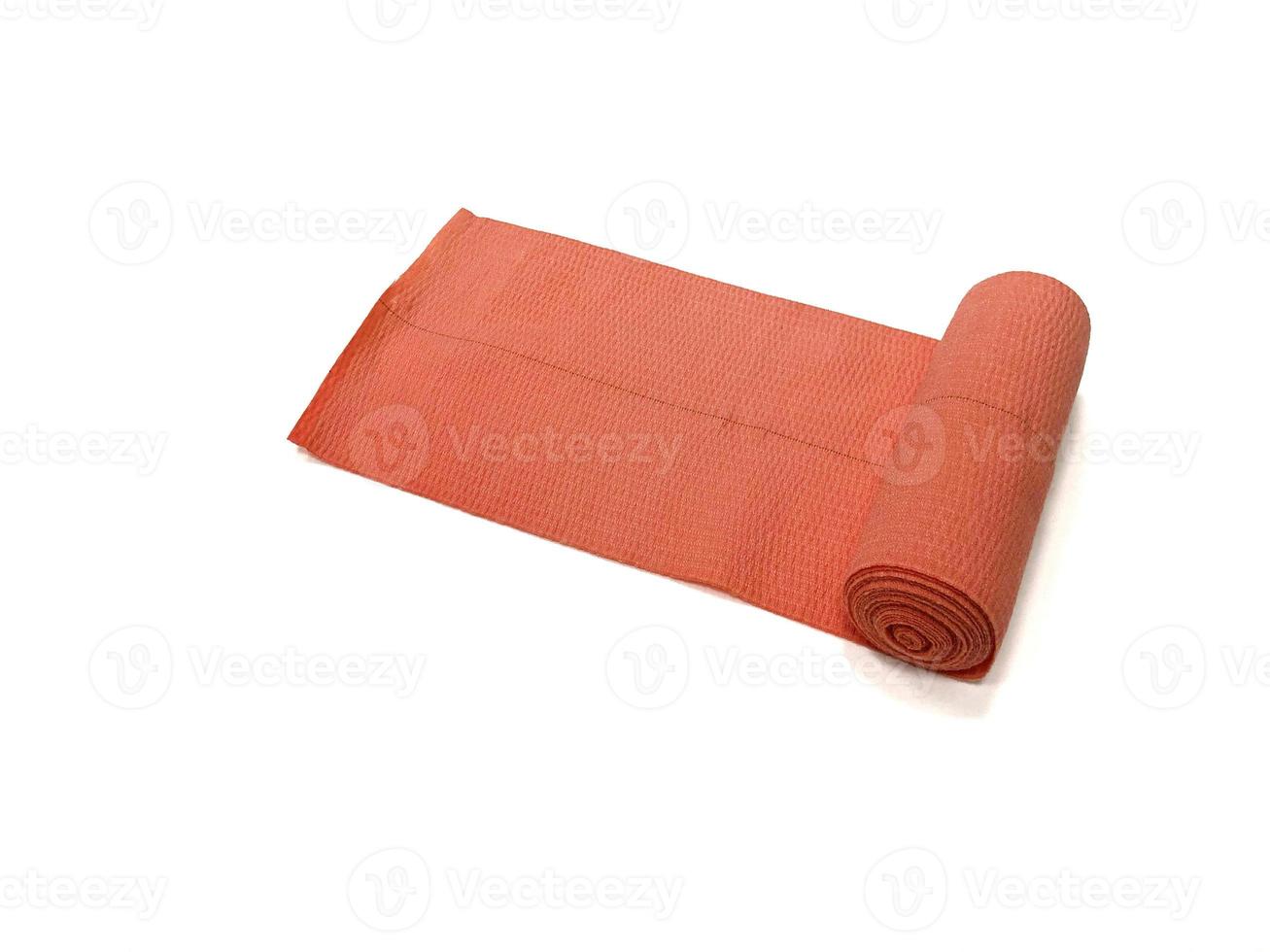 uma bandagem elástica laranja sobre fundo branco, isolada foto