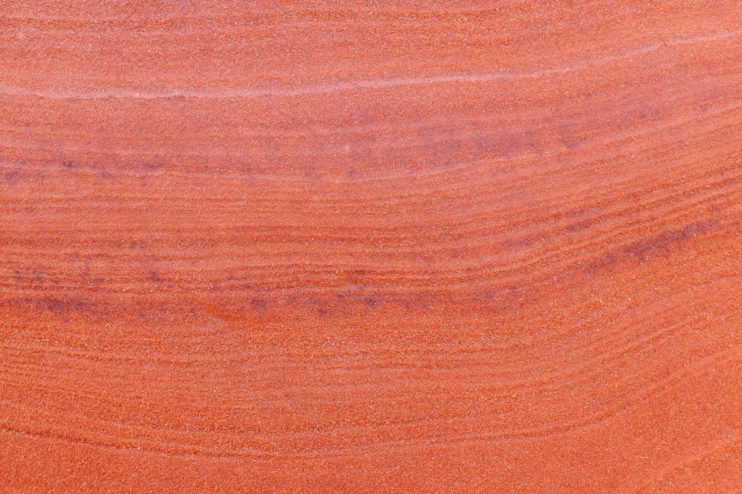 fundo de textura de pedra áspera vermelha. foto