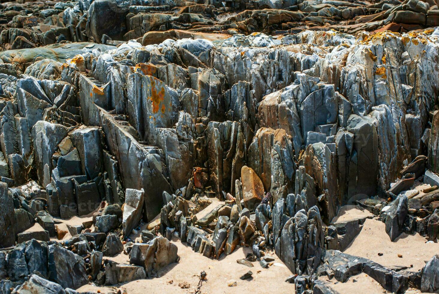 irregular Rocha textura às de praia foto