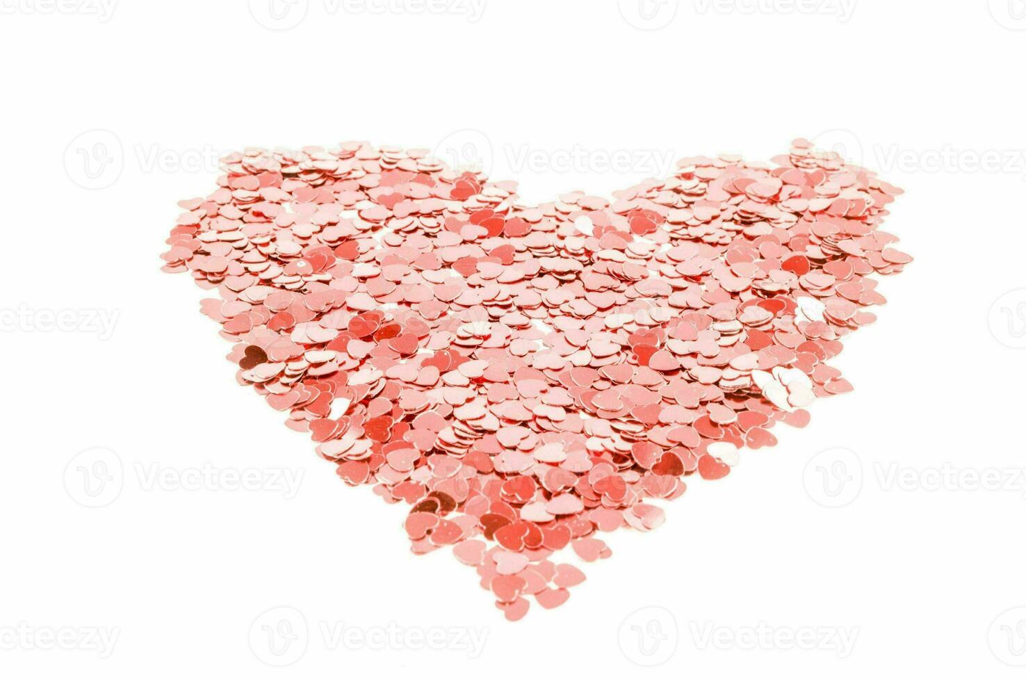 uma coração em forma pilha do Rosa confete foto
