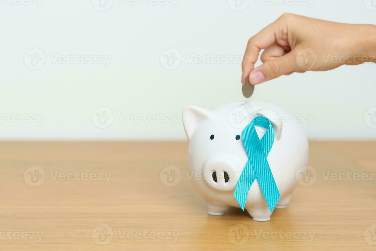 azul novembro próstata Câncer consciência mês, azul fita com porquinho banco para Apoio, suporte doença vida. saúde, doação, caridade, campanha, dinheiro salvando, fundo, internacional homens, pai e diabetes foto