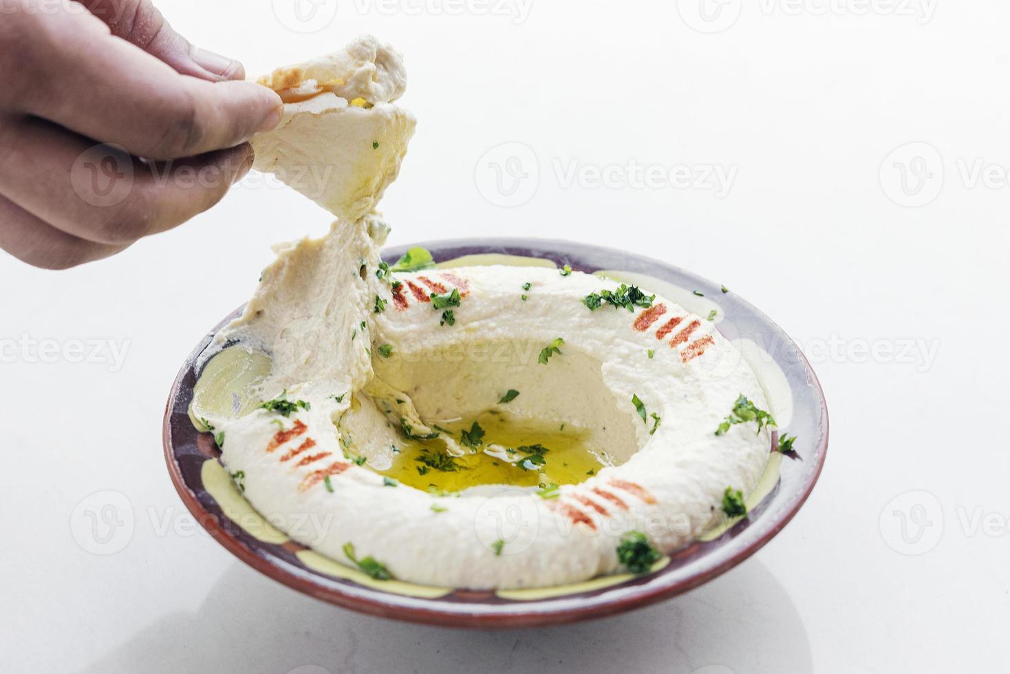 Molho de grão de bico meze mezze do Oriente Médio, conjunto de aperitivos iniciais foto