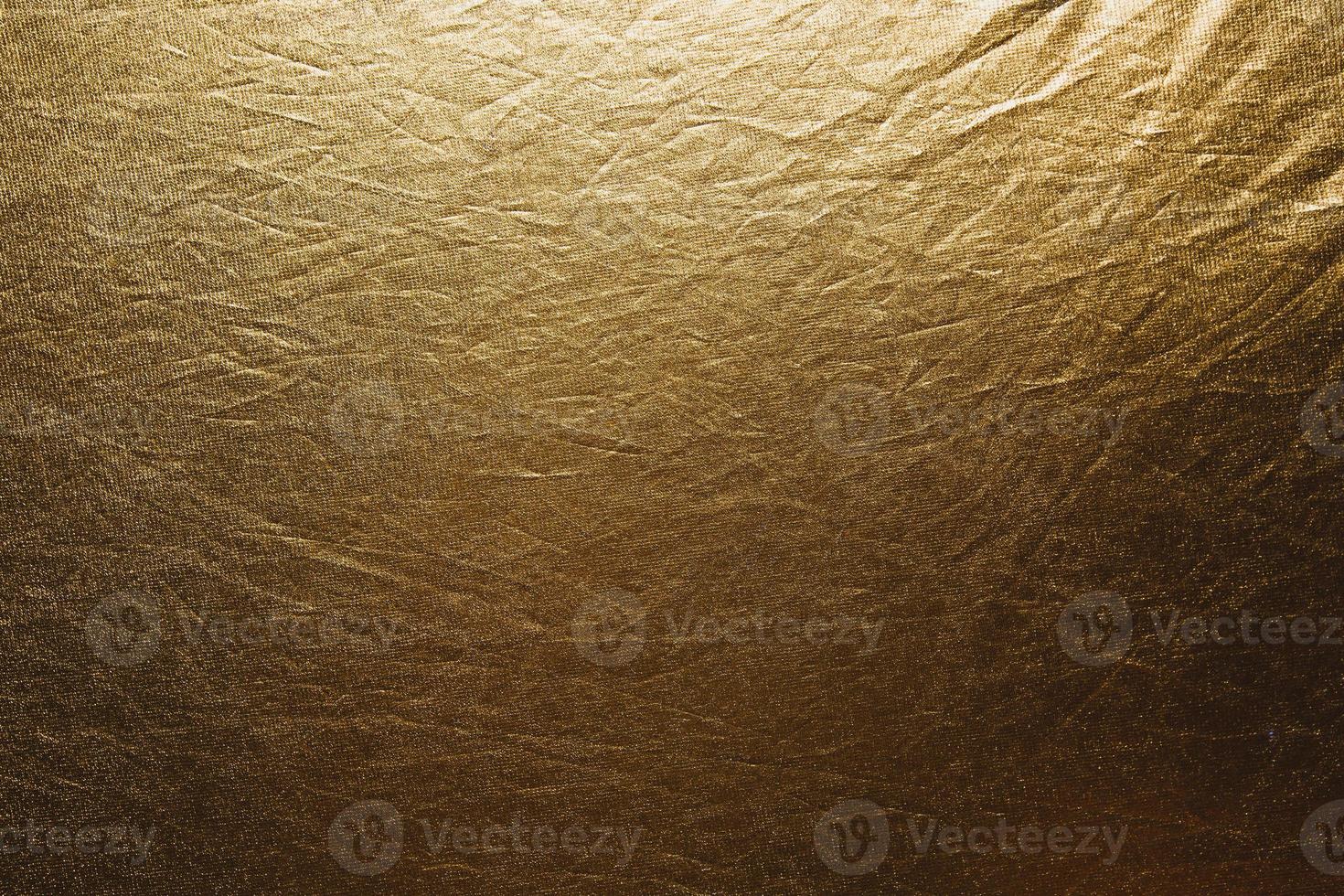 tecido dourado textura amarrotada foto