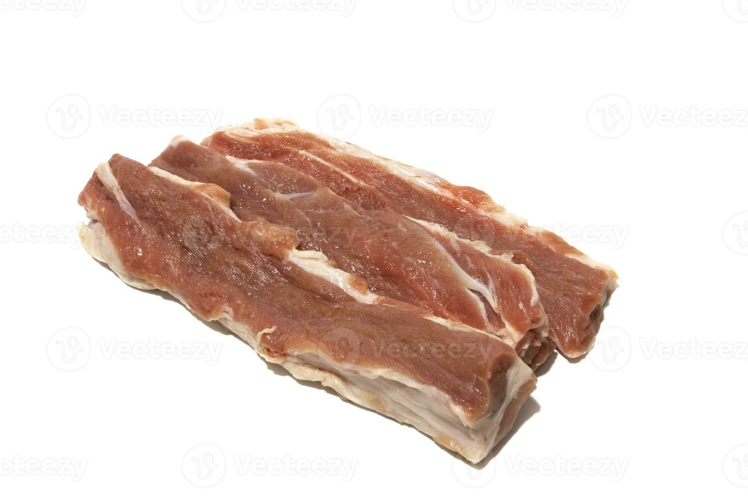 três peças do cru carne de porco ,ibérico lagarto, juntou entre a espinha dorsal e a lombo. isolado em uma branco fundo. espanhol Comida conceito. foto