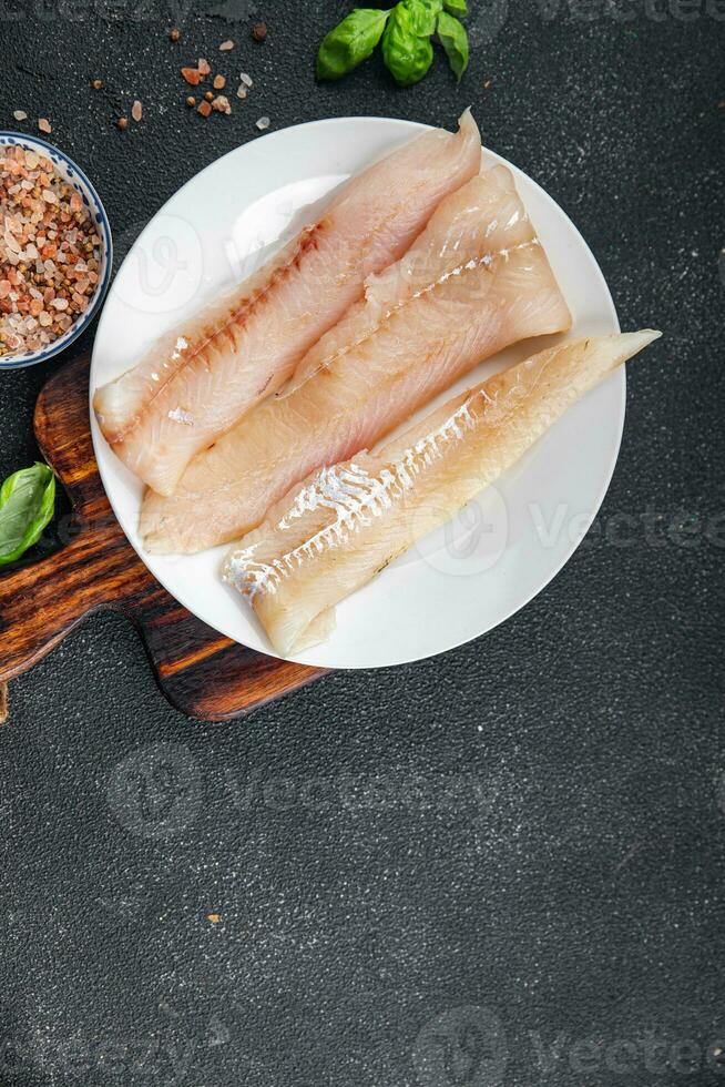 cru peixe filé azul badejo fresco frutos do mar saudável comendo cozinhando refeição Comida lanche em a mesa cópia de espaço Comida fundo rústico topo Visão foto