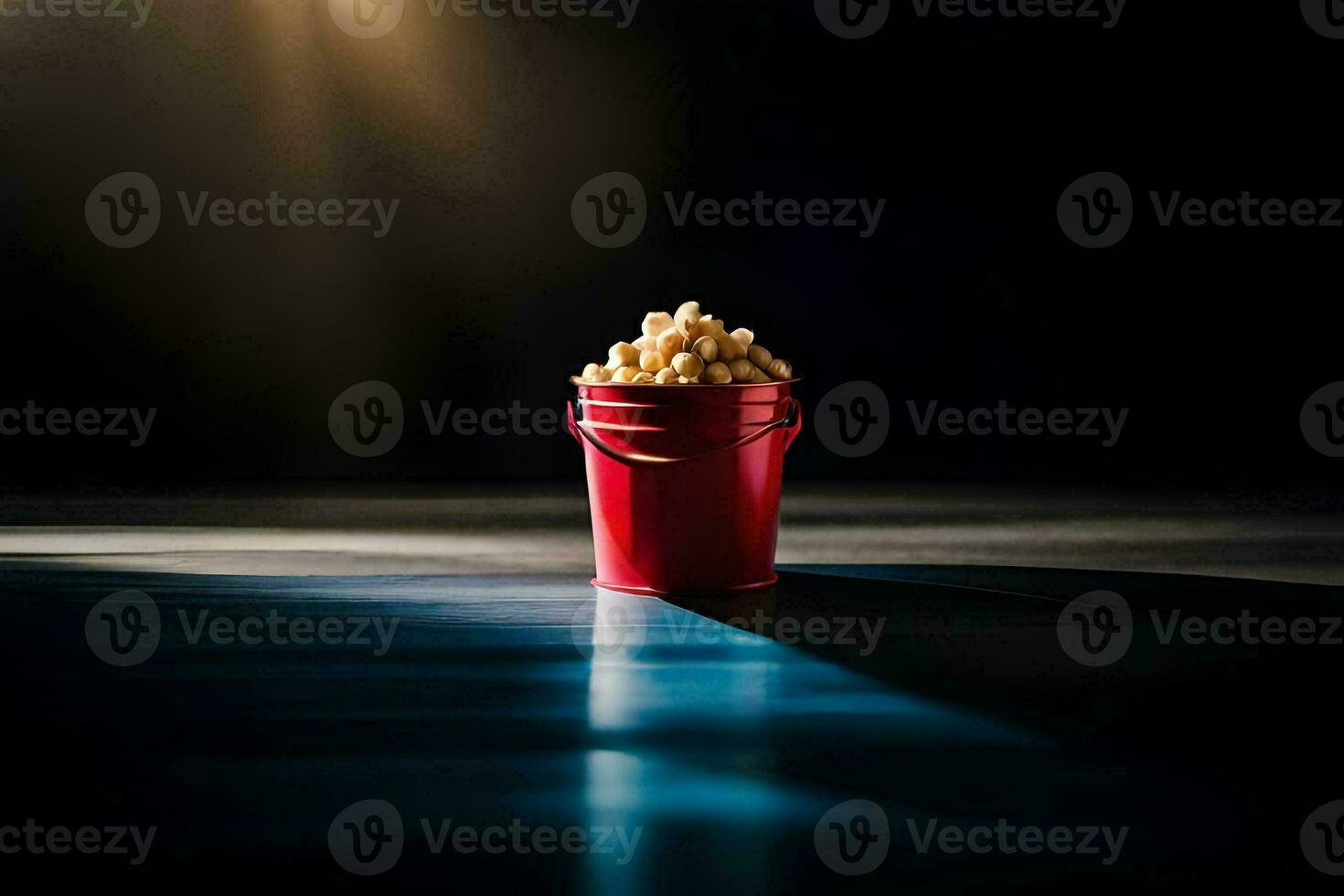 uma vermelho balde preenchidas com Pipoca em uma Sombrio chão. gerado por IA foto