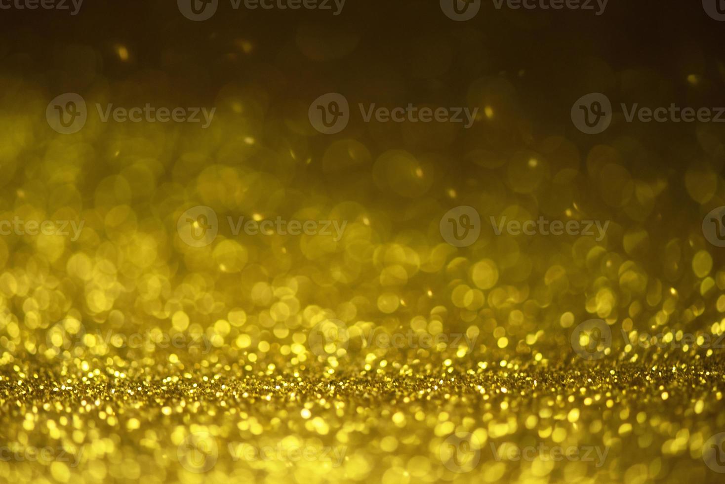 fundo de luzes brilhantes de glitter dourados foto