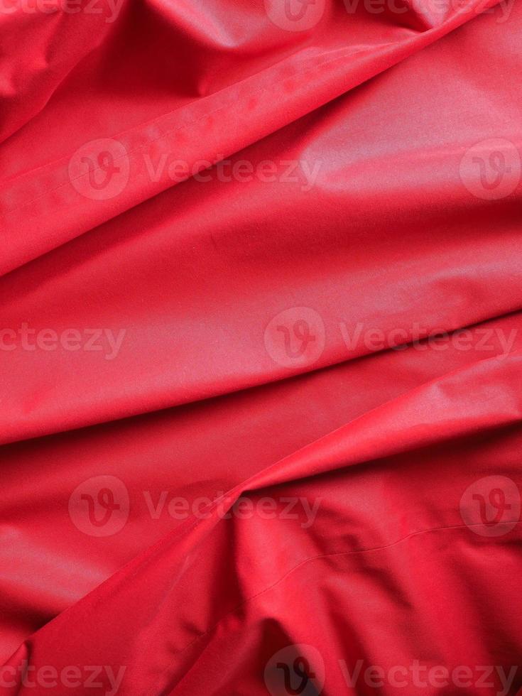 fundo de textura de tecido de poliéster vermelho ondulado foto