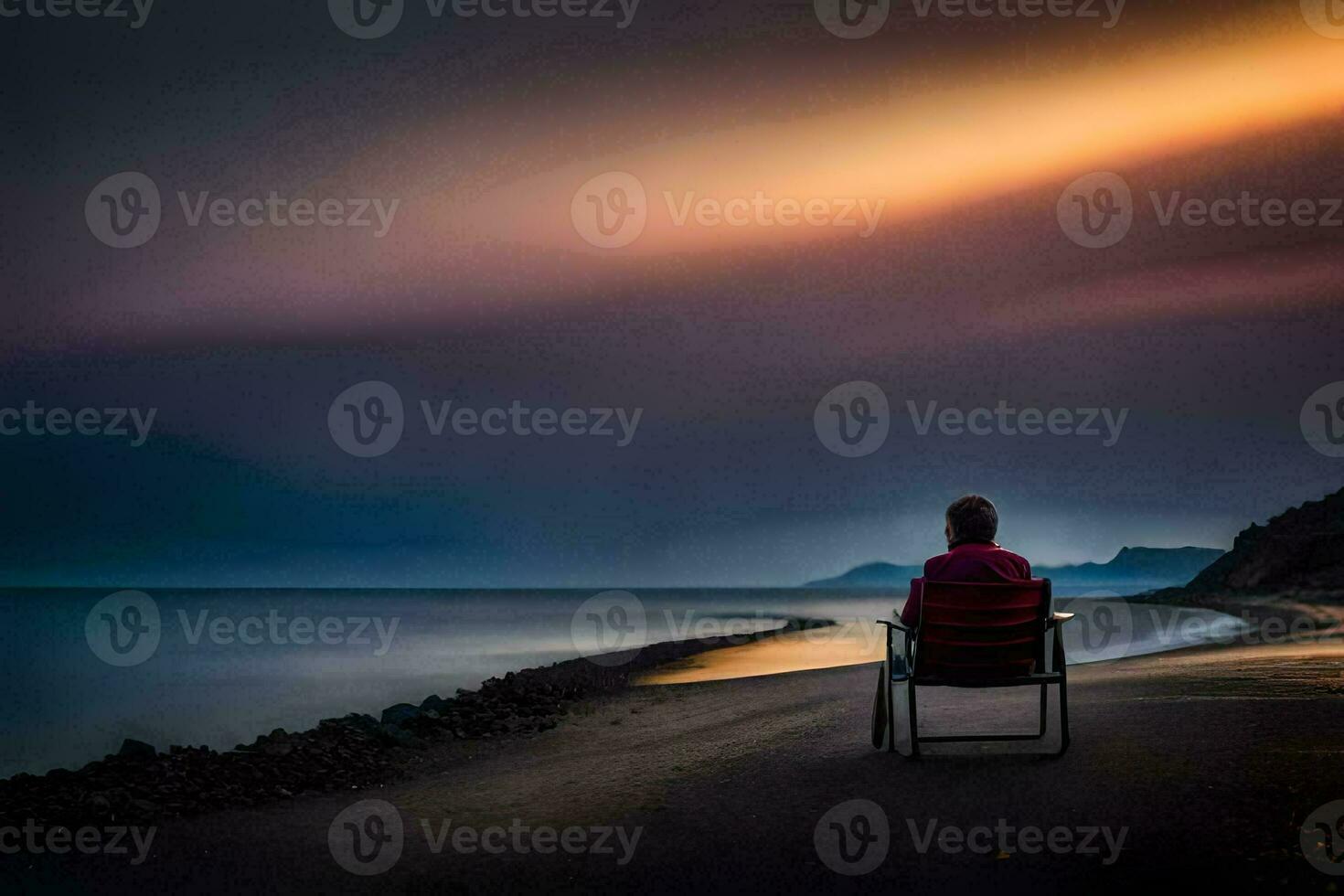 uma homem sentado dentro uma cadeira em a de praia às pôr do sol. gerado por IA foto