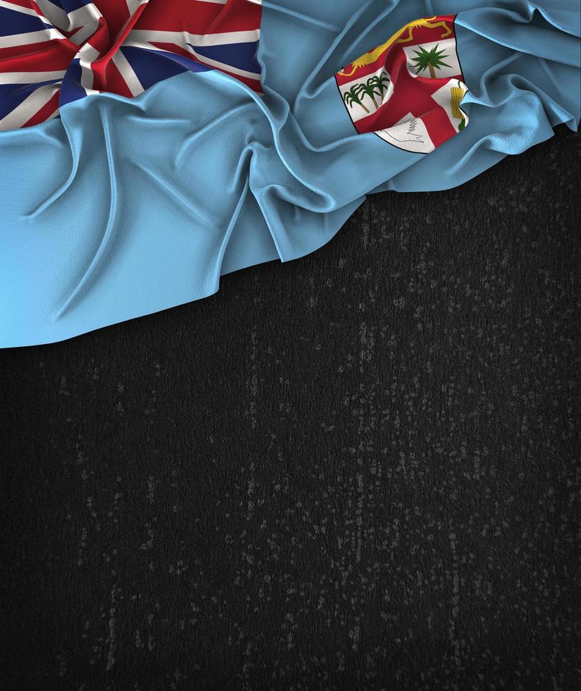 Bandeira de Fiji vintage em um quadro negro grunge com espaço para texto foto