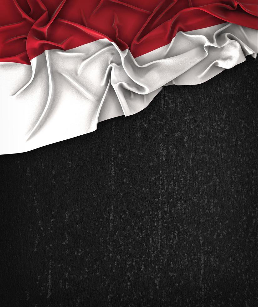 Bandeira da Indonésia vintage em um quadro negro grunge foto