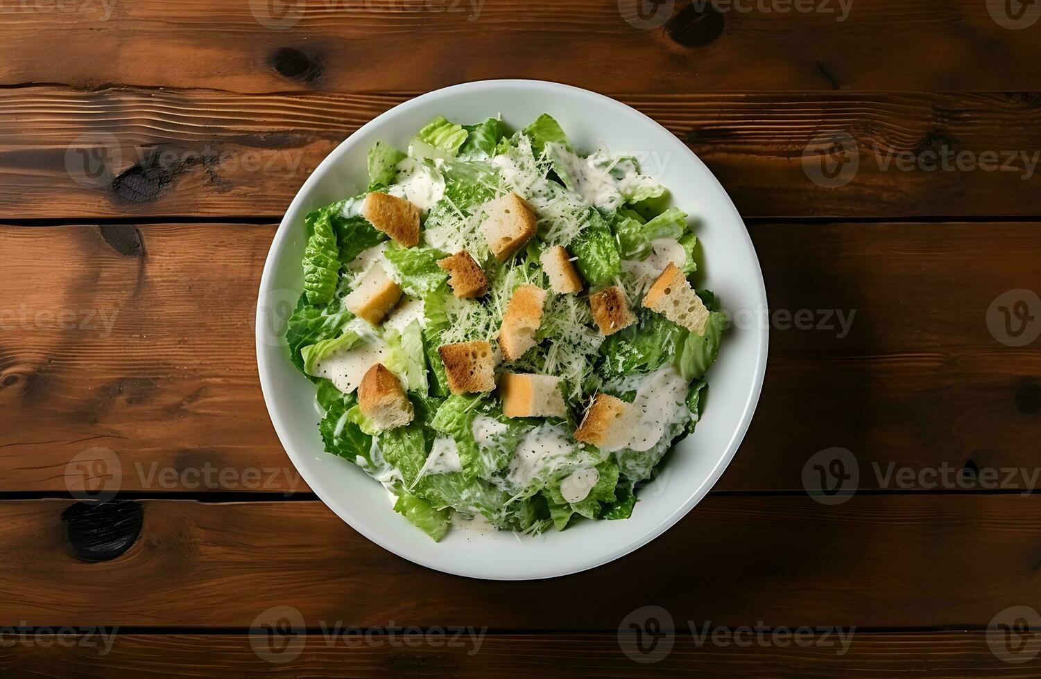 César salada com grelhado frango carne, alface e queijo, tiro a partir de a topo em a de madeira mesa fundo foto