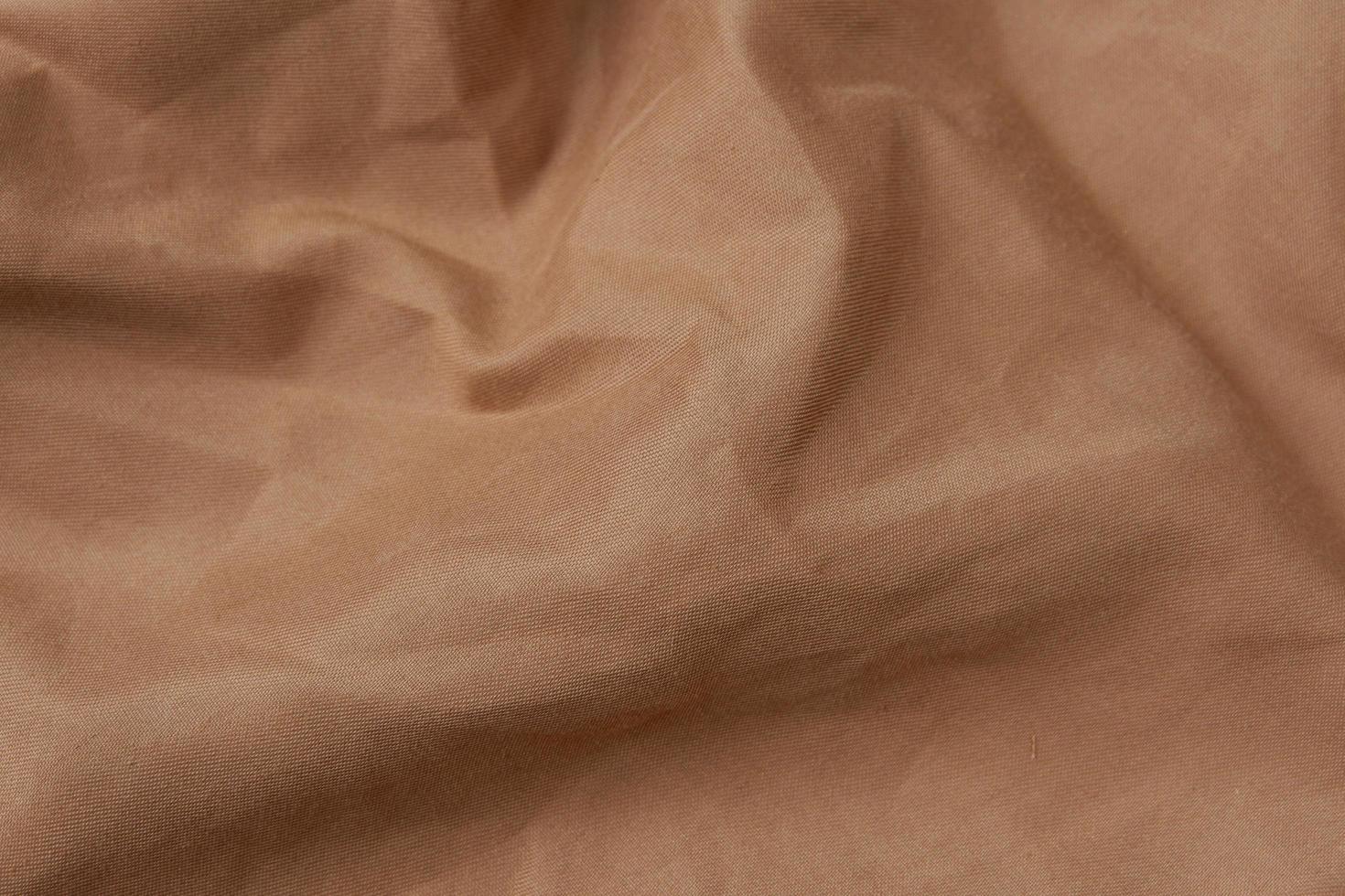 close-up de fundo de textura de pano marrom foto