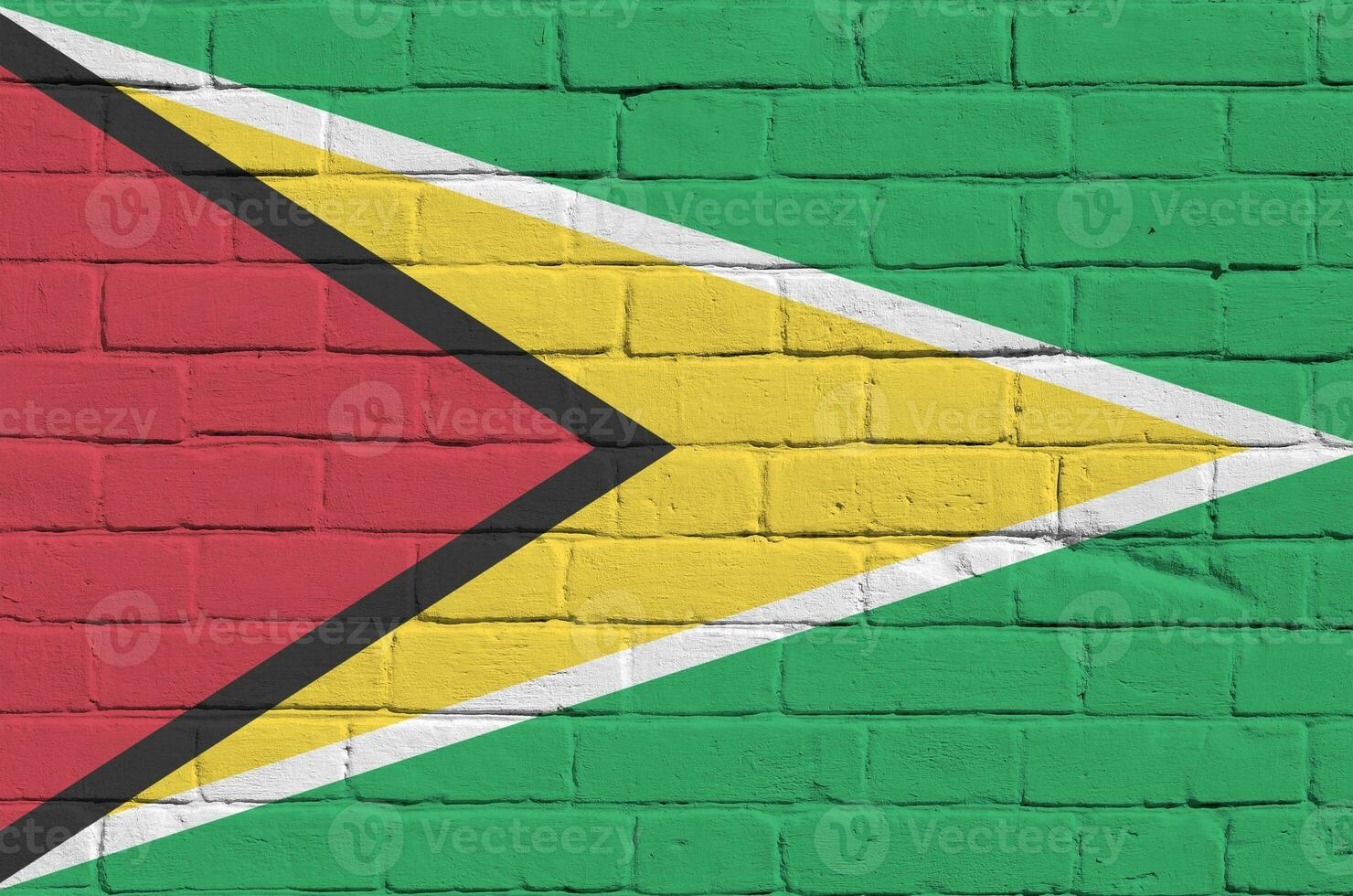 Guiana bandeira retratado dentro pintura cores em velho tijolo muro. texturizado bandeira em grande tijolo parede alvenaria fundo foto