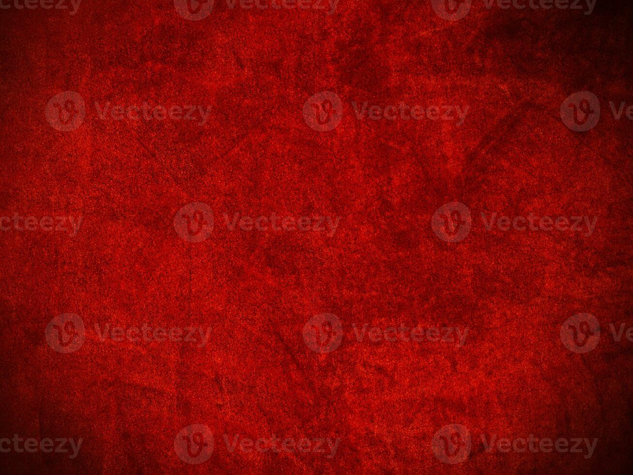 textura de tecido de veludo vermelho escuro usada como plano de fundo. fundo de tecido vermelho escuro vazio de material têxtil macio e liso. há espaço para o texto.. foto