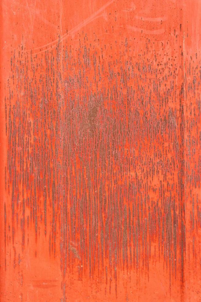 textura de metal enferrujado pintado com tinta vermelha foto