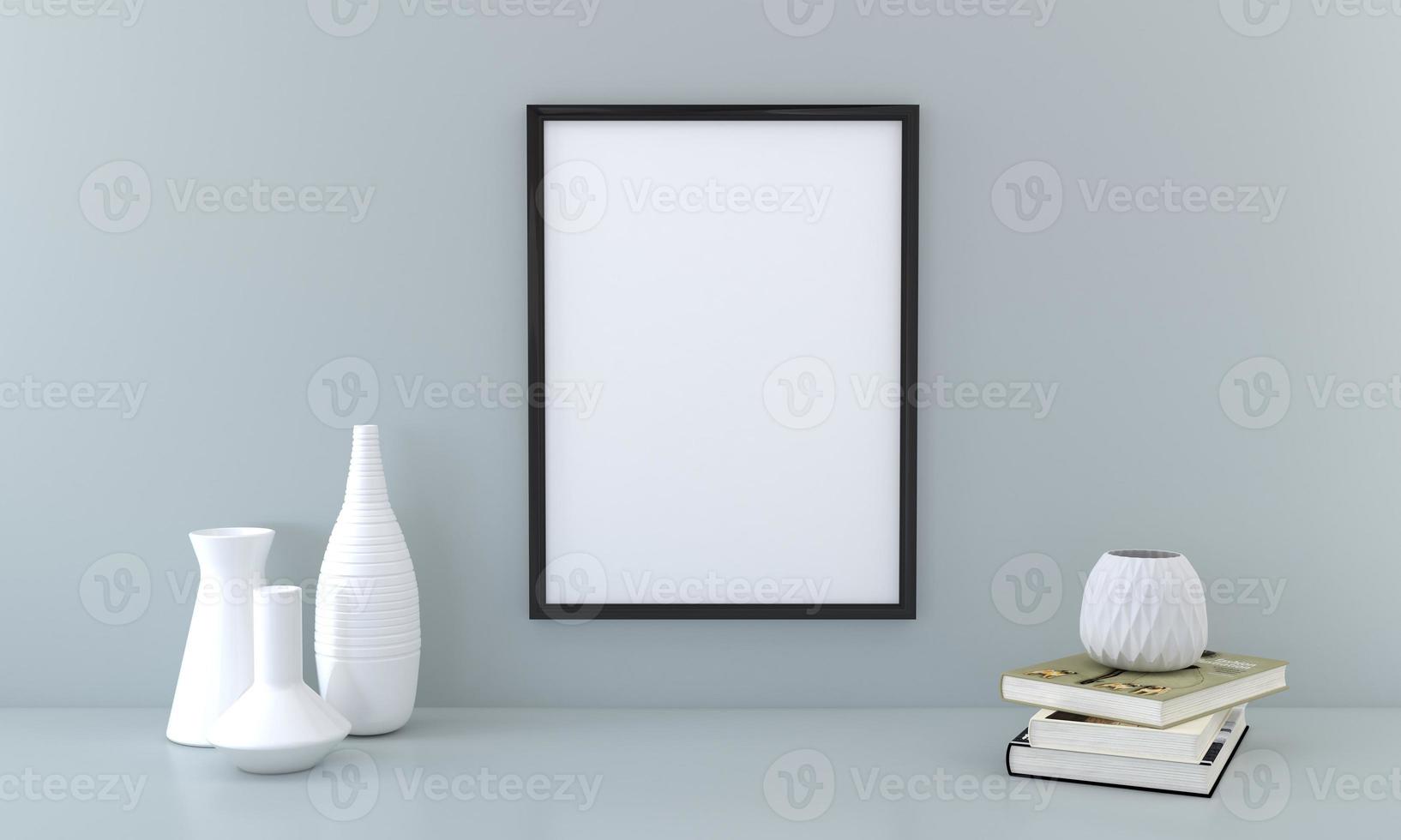 uma moldura em branco e vasos em uma mesa foto