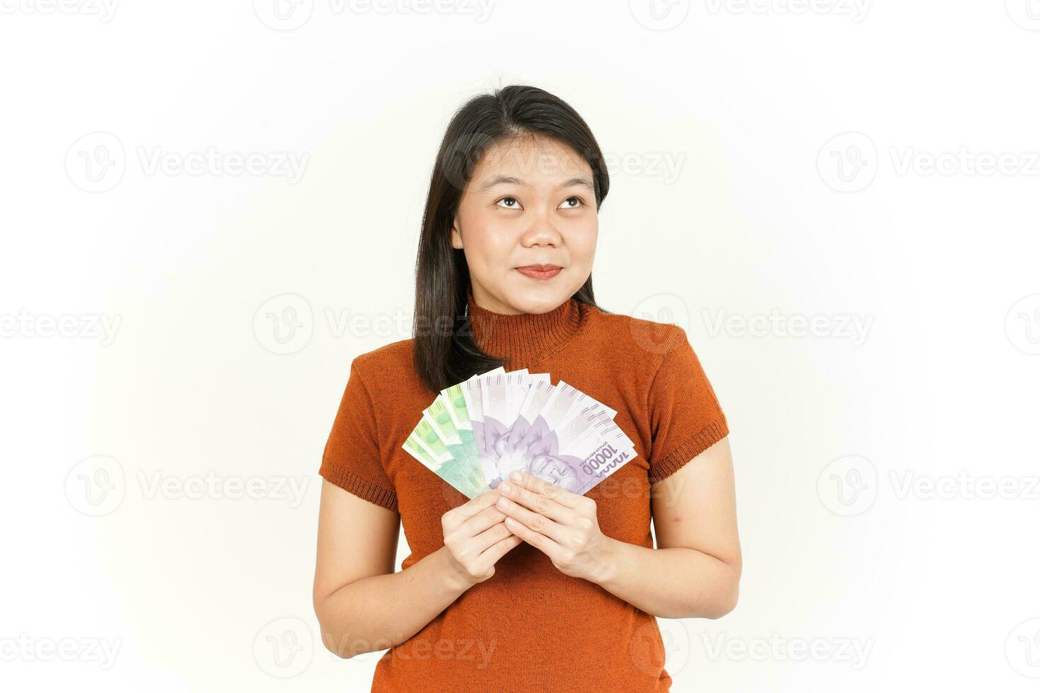 segurando dez mil e vinte mil indonésio rupia nota de banco do lindo ásia mulher foto