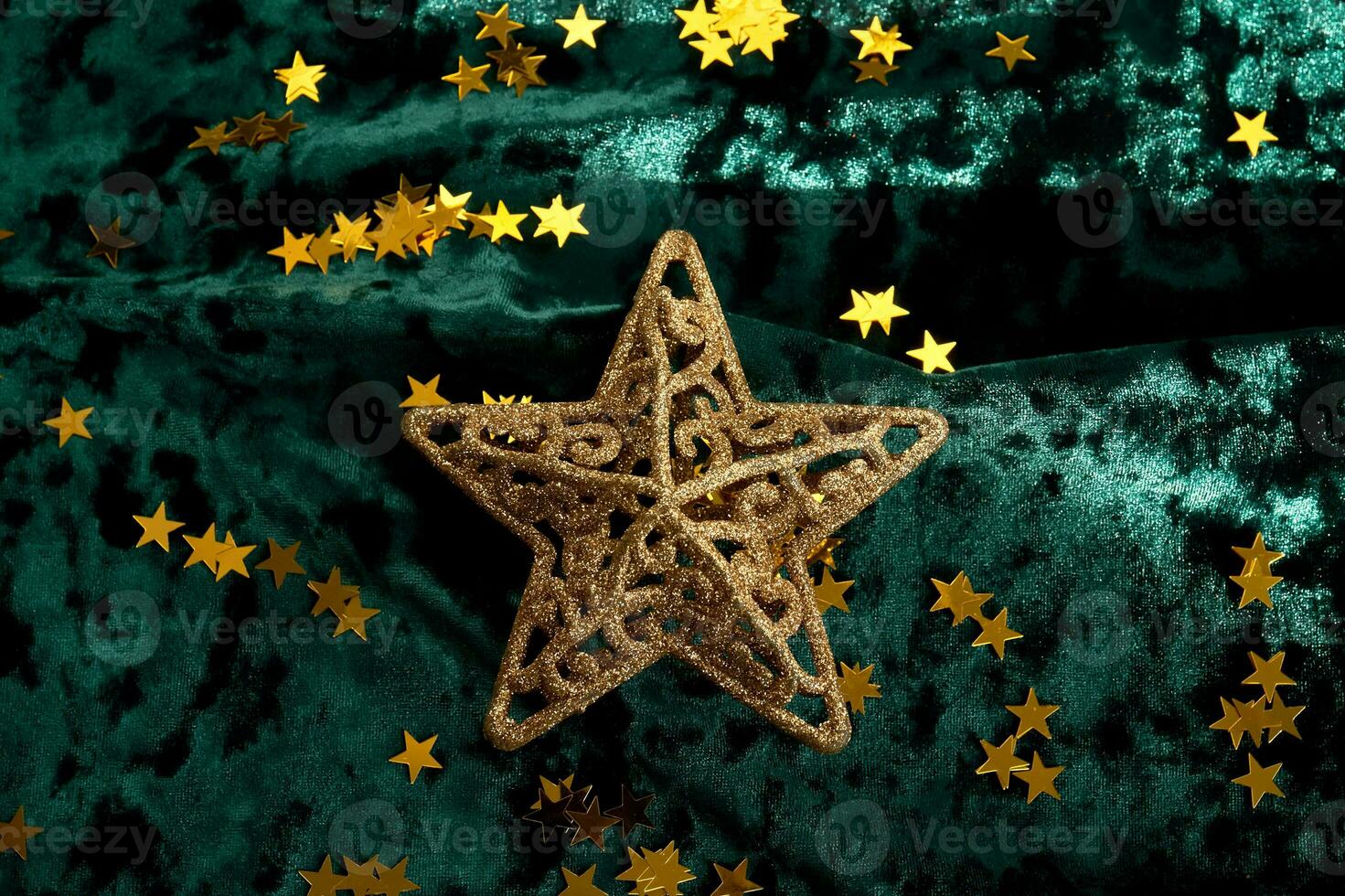 abstrato Natal fundo com ouro estrelas em uma verde veludo fundo. foto