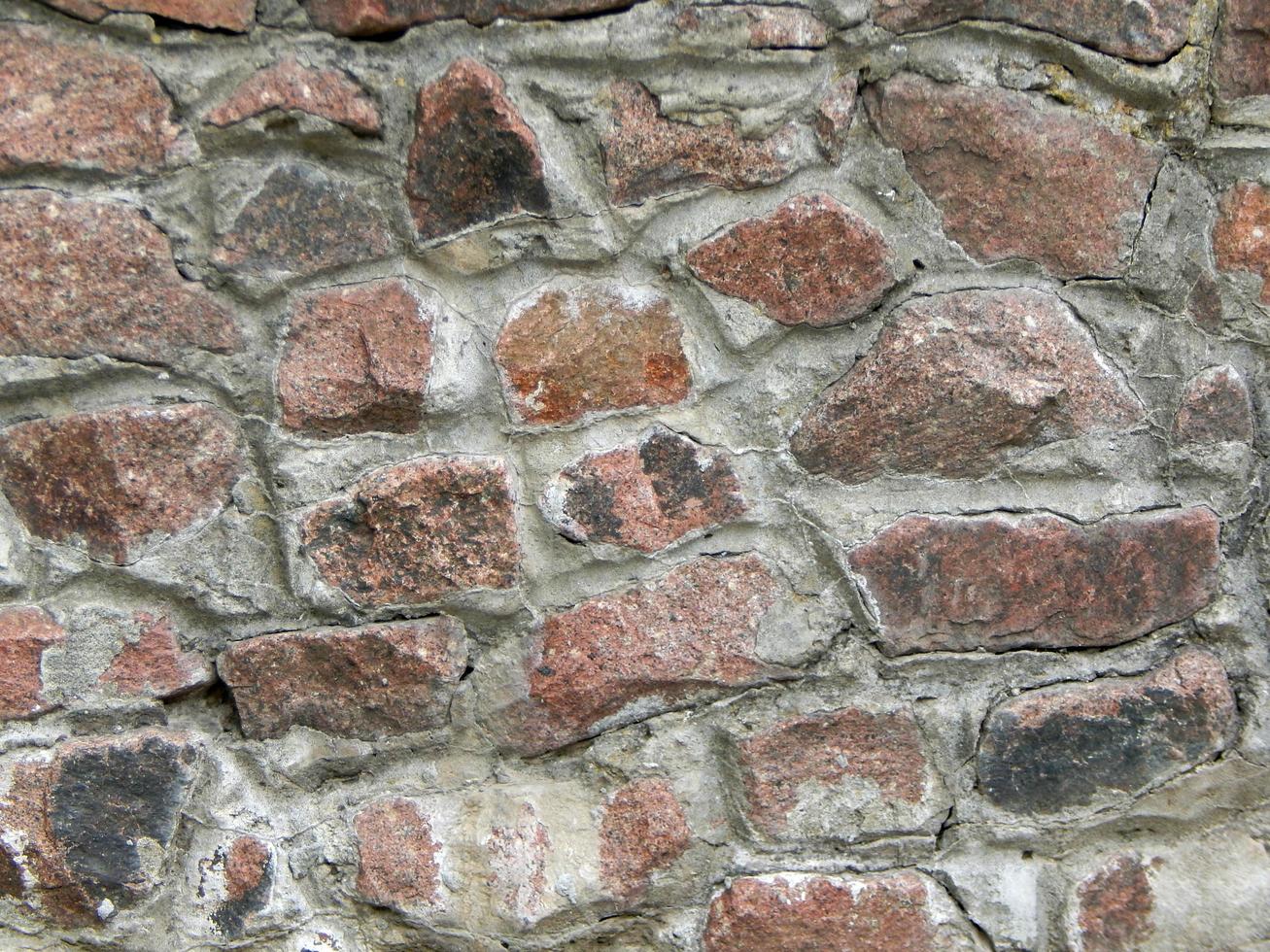 textura de material de pedra natural e paredes de alvenaria de tijolo foto