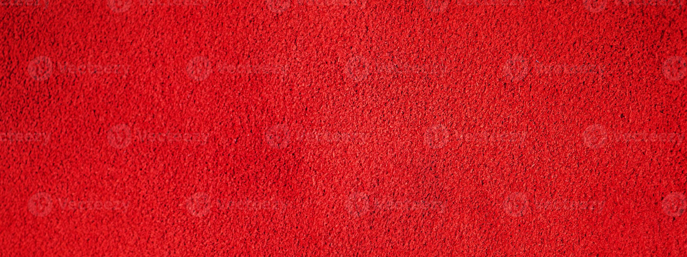 textura de couro de camurça vermelha. foto macro de uma textura de veludo vermelho.